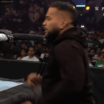 Man In Black Hoodie In Front Of Crowd With W Logo GIF