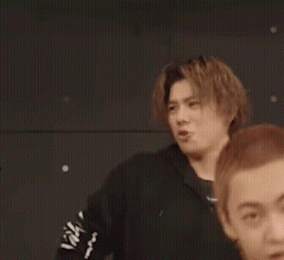 Man In Black Hoodie Making Funny Face Next To Man GIF