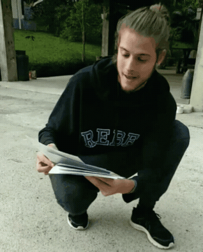 Man In Black Hoodie Saying Rebf Reading Book GIF