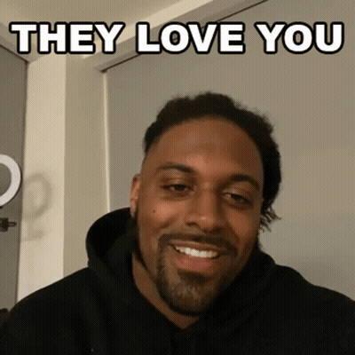 Man In Black Hoodie Smiling Saying They Love You GIF