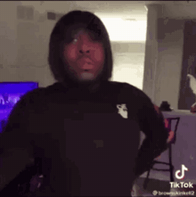 Man In Black Hoodie With Hands On Hips GIF