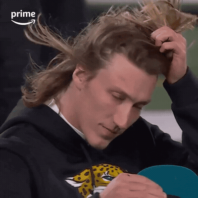Man In Black Hoodie With Leopard Print Holding Ponytail GIF