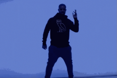 Man In Black Hoodie With Owl Making Peace Sign GIF
