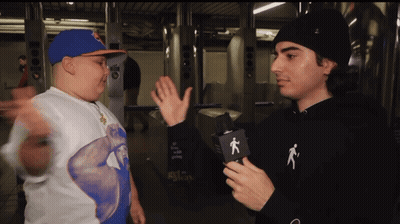Man In Black Hoodie With Person Talking GIF