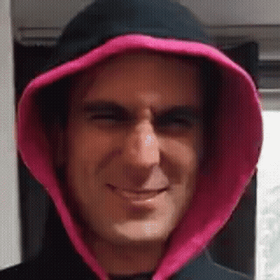 Man In Black Hoodie With Pink Hood Smiling GIF