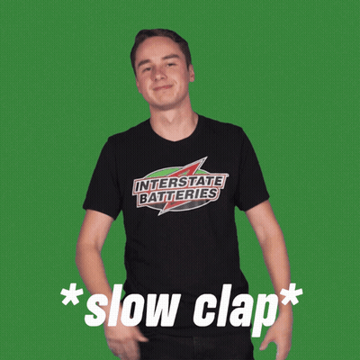 Man In Black Interstate Batteries Shirt GIF