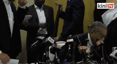Man In Black Jacket Adjusting Collar GIF