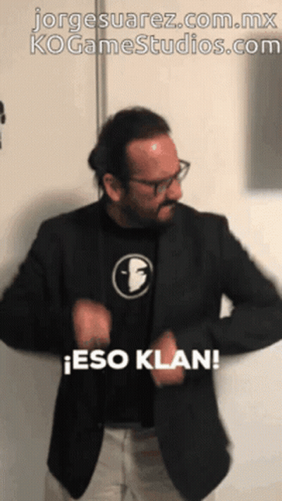 Man In Black Jacket And Face Shirt Says Eso Klan GIF