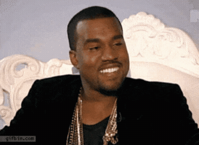 Man In Black Jacket And Gold Necklace Smiling GIF