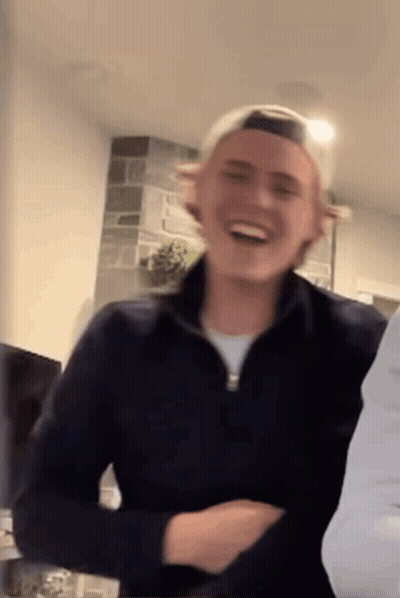 Man In Black Jacket And White Hat Smiling GIF