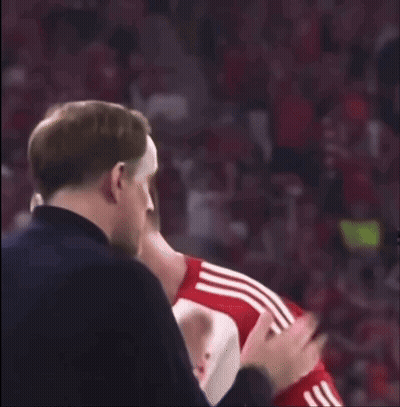 Man In Black Jacket Applauding Soccer Player In Red Shirt GIF