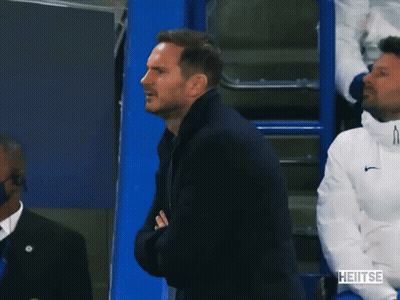 Man In Black Jacket Applauds In Front Of Blue Cooler Saying Heitse GIF
