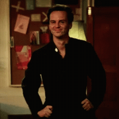 Man In Black Jacket At Bulletin Board GIF