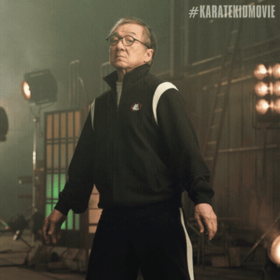 Man In Black Jacket At Karatekidmovie Sign GIF