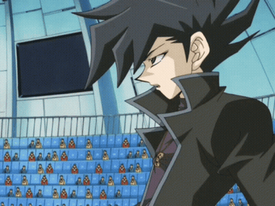Man In Black Jacket Before Stadium Crowd GIF