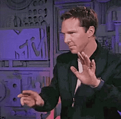 Man In Black Jacket Dancing In Front Of MTV Sign GIF