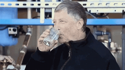 Man In Black Jacket Drinking From Glass GIF
