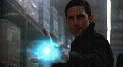 Man In Black Jacket Holding Blue Object GIF