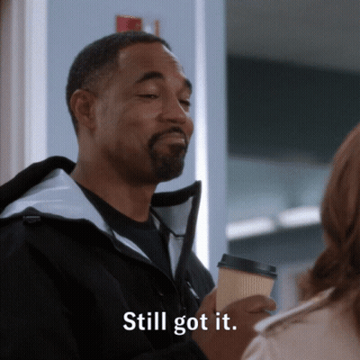 Man In Black Jacket Holding Coffee Says Still Got It GIF