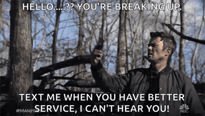 Man In Black Jacket Holding Gun In Forest Saying Hello You're Breaking Up GIF
