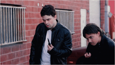 Man In Black Jacket Holding Knife GIF