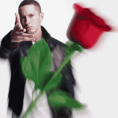 Man In Black Jacket Holding Large Red Rose GIF
