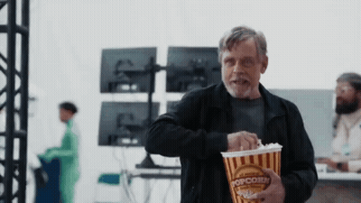 Man In Black Jacket Holding Popcorn GIF