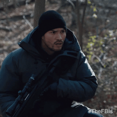 Man In Black Jacket Holding Rifle FBLS GIF