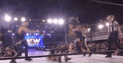 Man In Black Jacket Holding Rifle With FBLS GIF