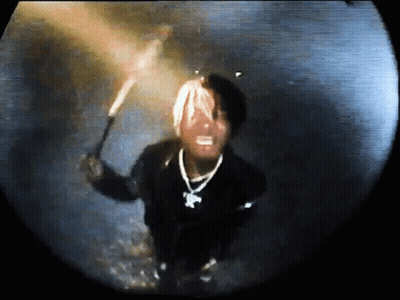 Man In Black Jacket Holding Torch Dark Room GIF