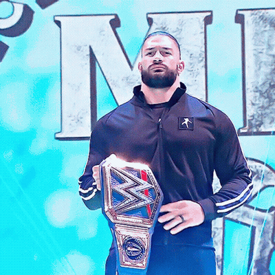 Man In Black Jacket Holding Wrestling Belt GIF