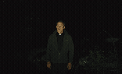 Man In Black Jacket In Dark GIF