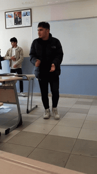 Man In Black Jacket In Front Of Ataturk Sign GIF