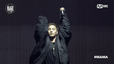 Man In Black Jacket In Front Of Mnet Sign GIF