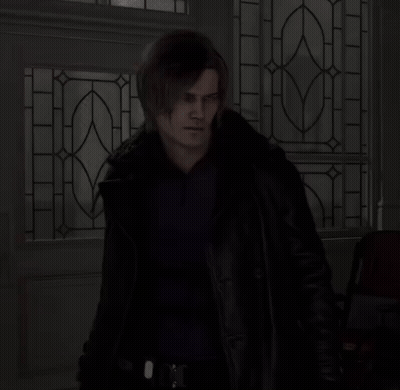 Man In Black Jacket In Front Of Stained Glass Door GIF