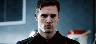 Man In Black Jacket Looking At Camera GIF