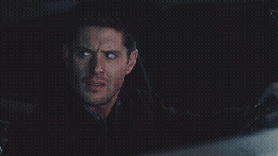 Man In Black Jacket Looking In Dark GIF