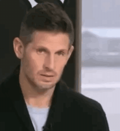 Man In Black Jacket Making Funny Face By Window GIF