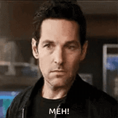Man In Black Jacket Making Meh Face GIF