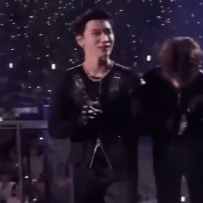 Man In Black Jacket Next To Another Man GIF