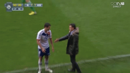 Man In Black Jacket Next To Man In White Shirt GIF
