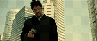 Man In Black Jacket Pointing Gun GIF