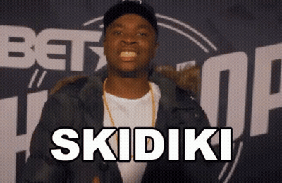 Man In Black Jacket Says Skidiki In Front Of BET Logo GIF