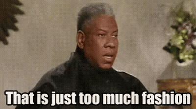Man In Black Jacket Says That Is Just Too Much Fashion Beside Vase Of Flowers GIF