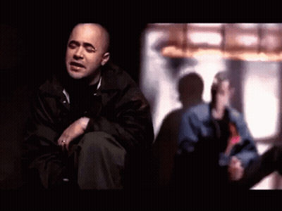 Man In Black Jacket Sitting By Window GIF