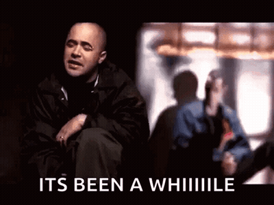 Man In Black Jacket Sitting By Window GIF