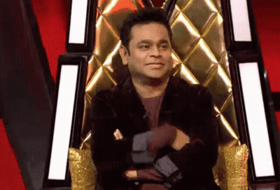 Man In Black Jacket Sitting Crossed Arms GIF