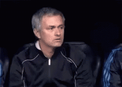 Man In Black Jacket Sitting In Dark Room With Cigarette GIF