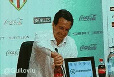 Man In Black Jacket Sitting In White Cushion Chair GIF