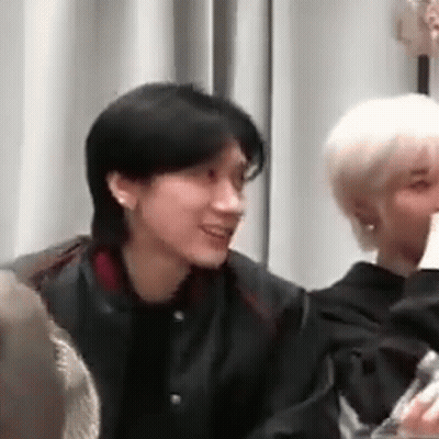 Man In Black Jacket Sitting Next To Woman In White Shirt GIF